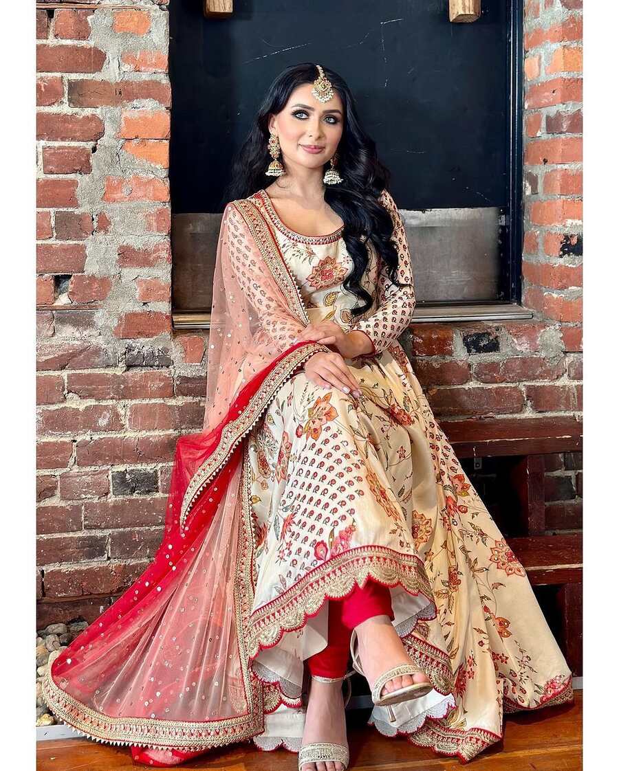 Elegant model showcasing the FABULOUS GEORGETTE EMBROIDERY SEQUENCE WITH DIAMOND HAND WORK GOWN BOTTOM WITH DUPATTA WHITE.