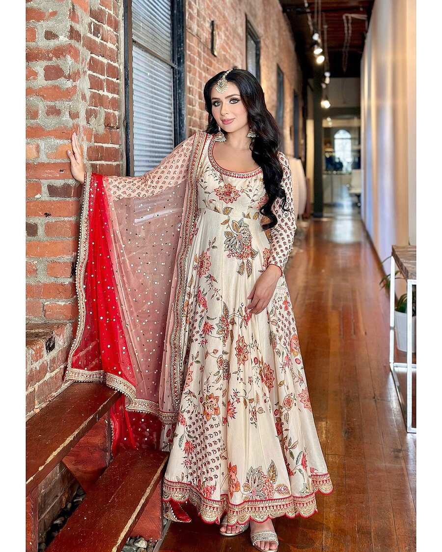 Elegant model showcasing the FABULOUS GEORGETTE EMBROIDERY SEQUENCE WITH DIAMOND HAND WORK GOWN BOTTOM WITH DUPATTA WHITE.